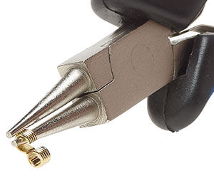 pliers holding link